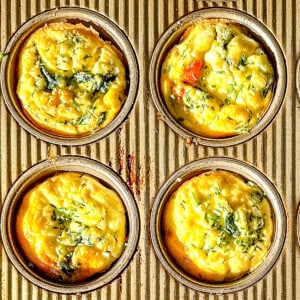 Spinach and feta muffin pan frittatas in the pan.