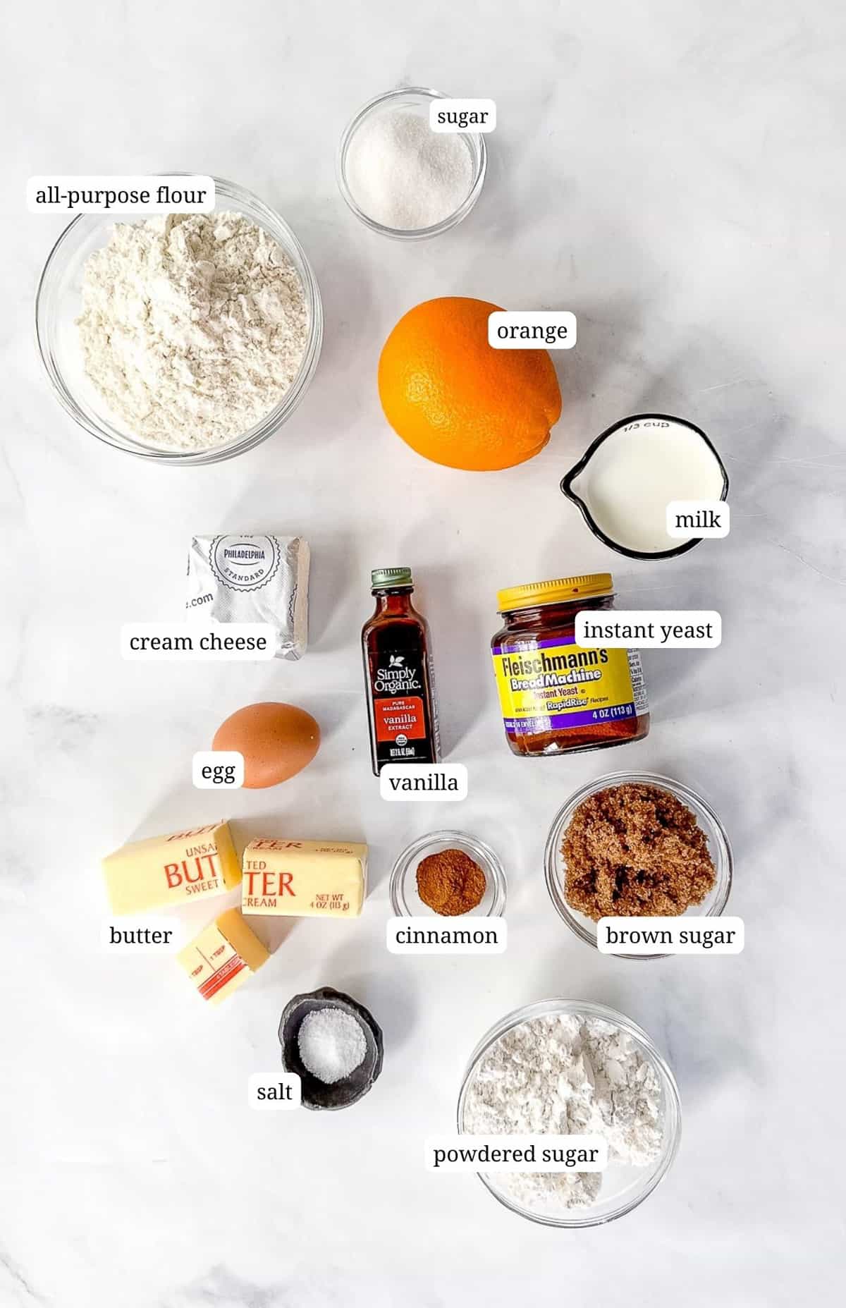 Labeled image of the ingredients needed to make blueberry orange cinnamon rolls.
