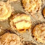 Cut view of a sour cream coffee cake muffin.