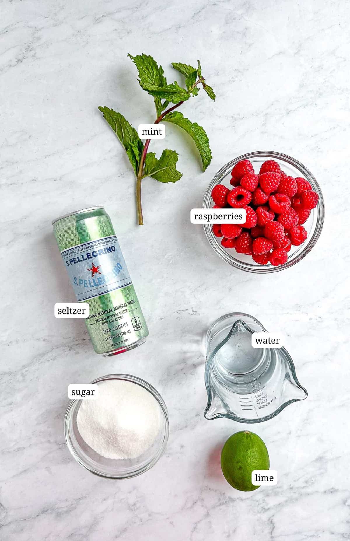 Labeled image of ingredients needed to make raspberry Mojito Mocktail.