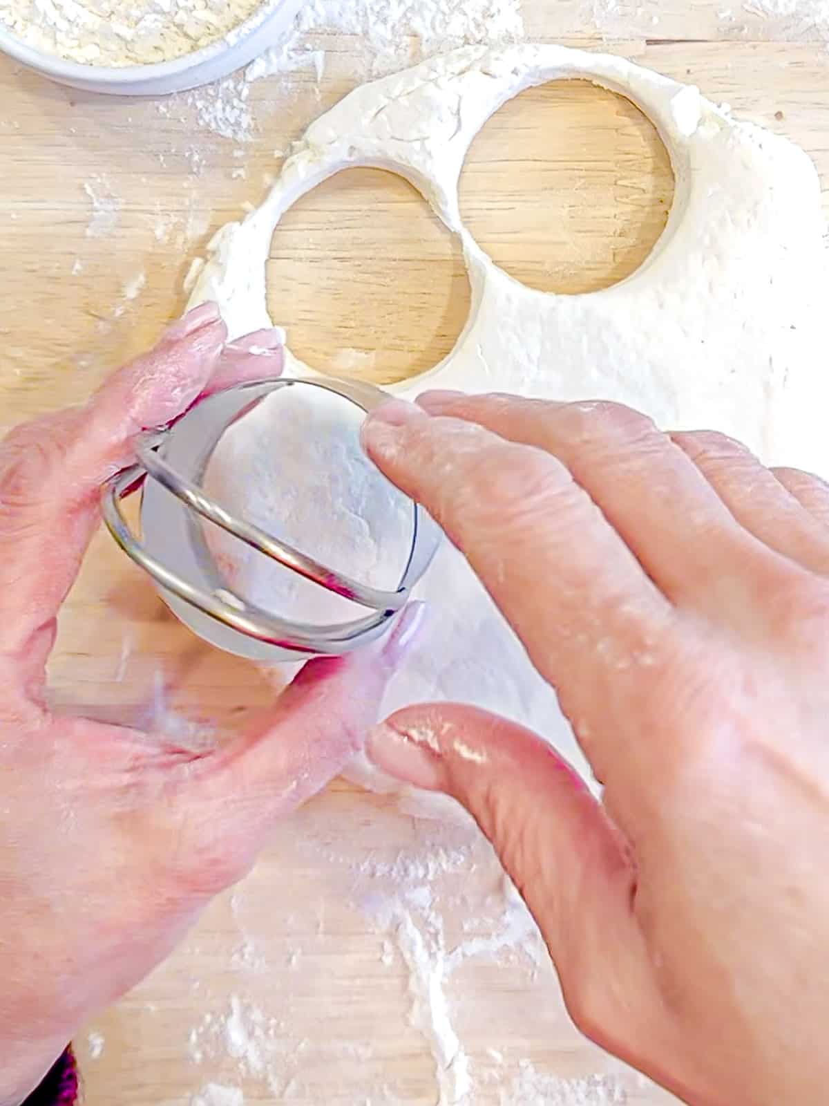 Cutting out two ingredient biscuits.