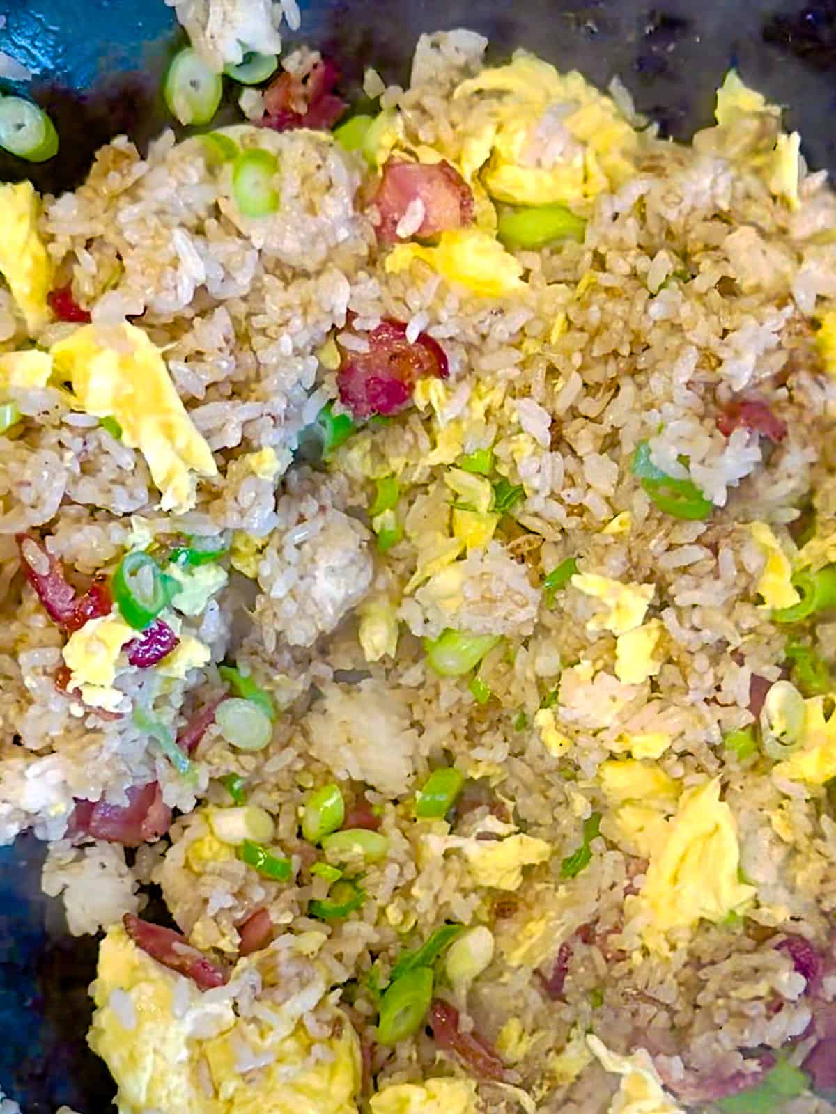 Making bacon and egg fried rice.