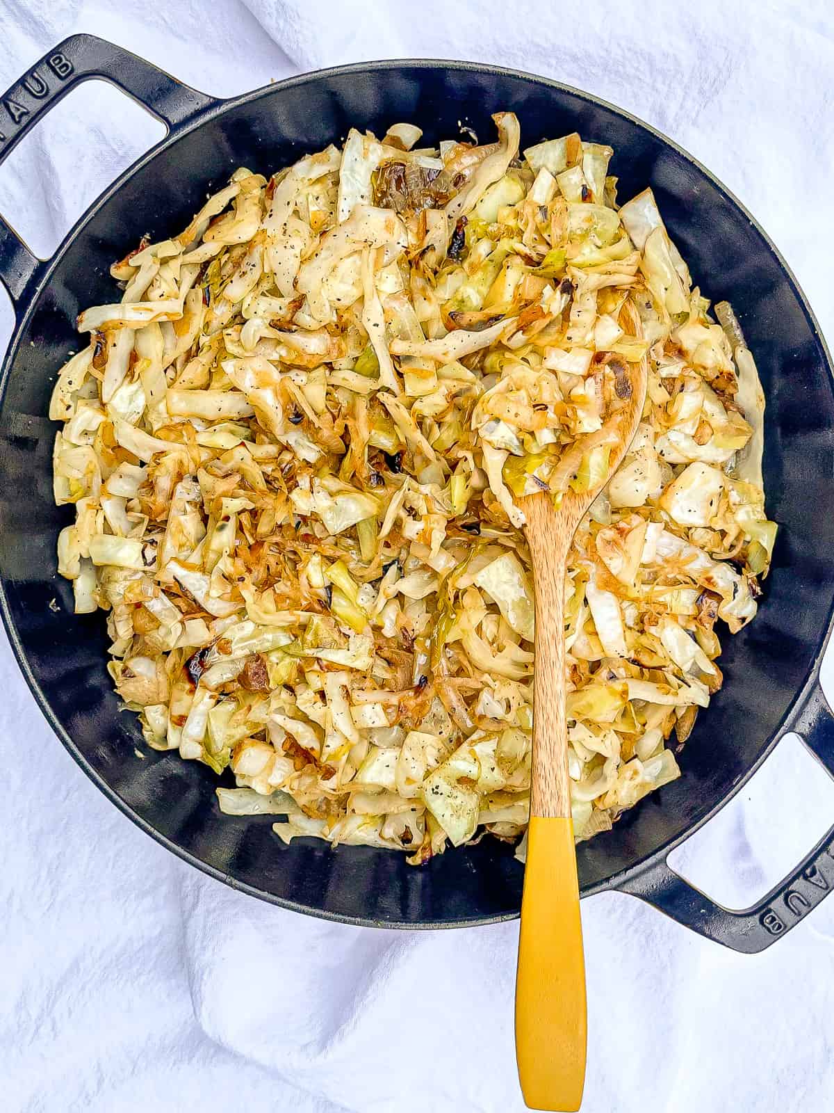 Cast iron pan of southern fried cabbage.