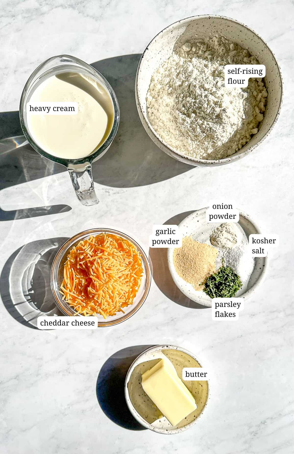 Labeled image of ingredients to make easy cheddar bay biscuits.