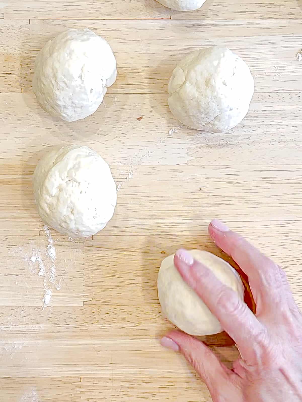 Rolling 2 Ingredient bagel dough into a ball.