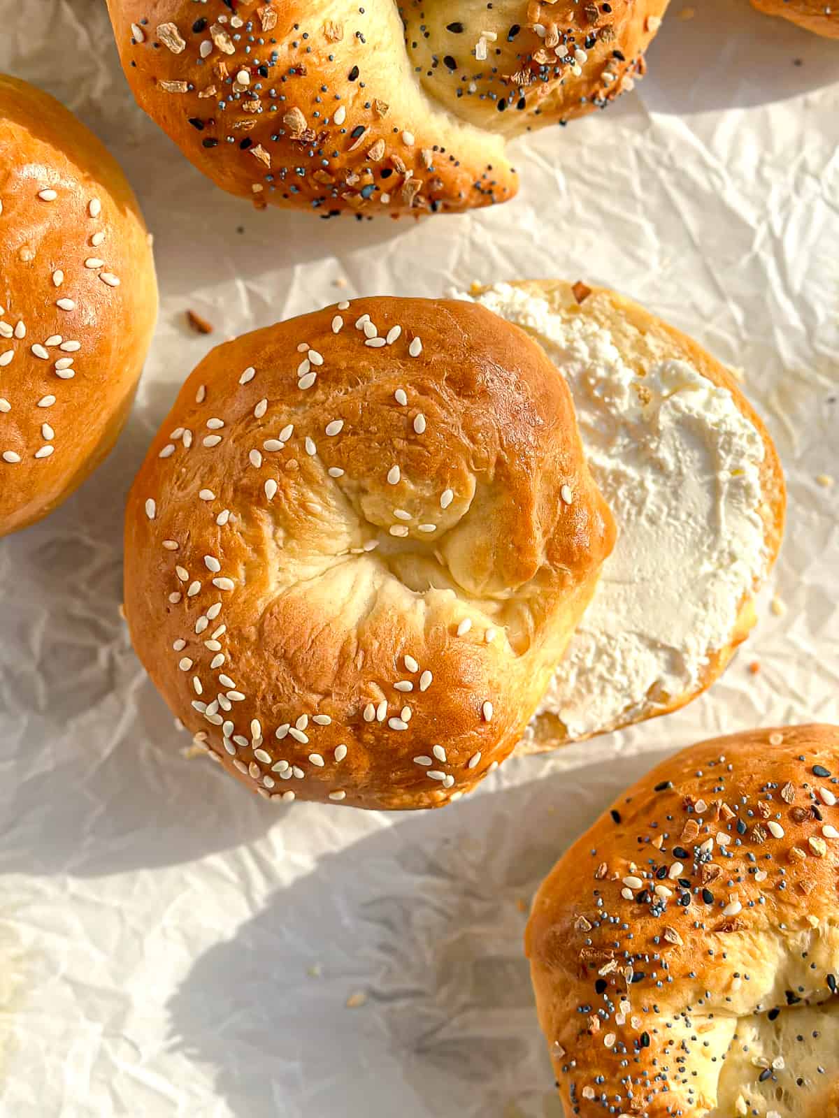 A sesame seed 2 Ingredient bagel with cream cheese.