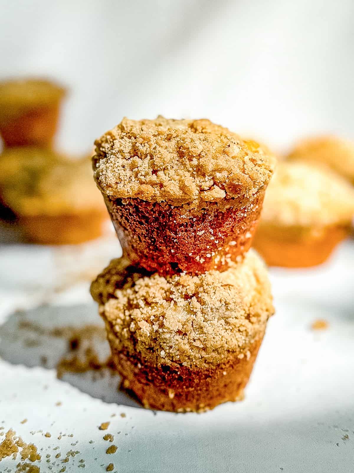 Two banana nut muffins stacked on on top of the other.