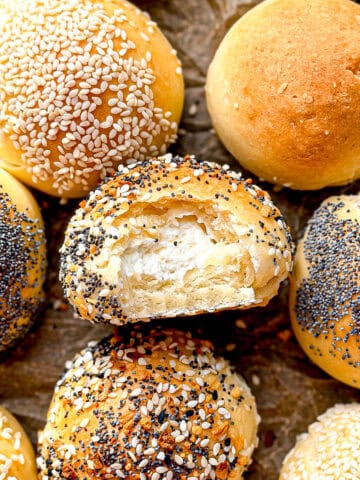 Bagel bites on parchment paper.