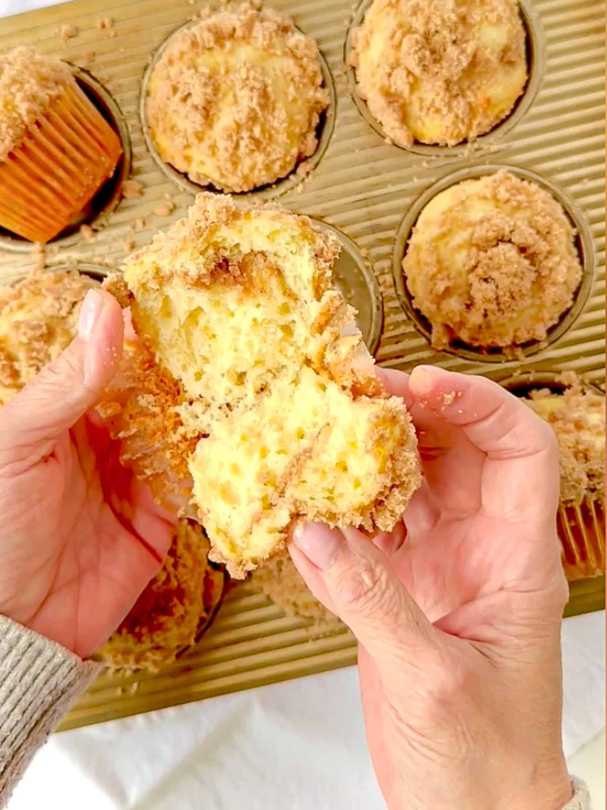 Cinnamon streusel swirl muffins in a muffin tin.