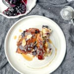 Top view of a slice of blueberry croissant baked french toast.