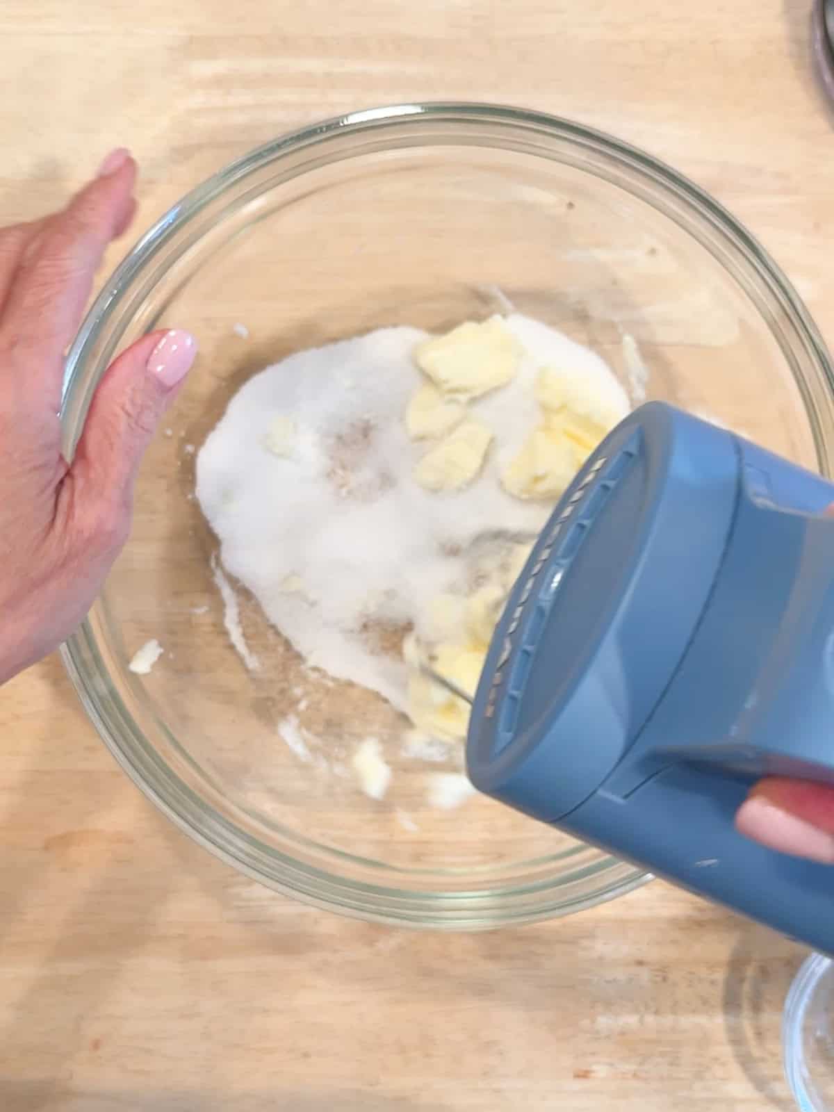 Creaming butter and sugar together to make pistachio cream.