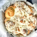 Almond sweet rolls covered with cream cheese frosting and sliced almonds.