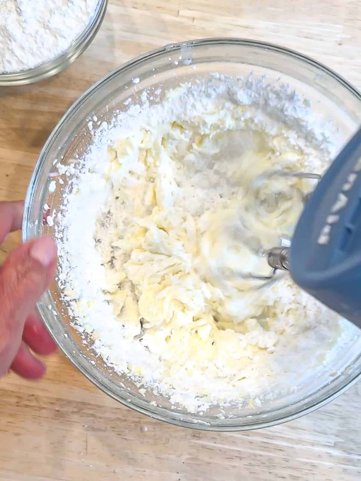 Making cream cheese frosting.