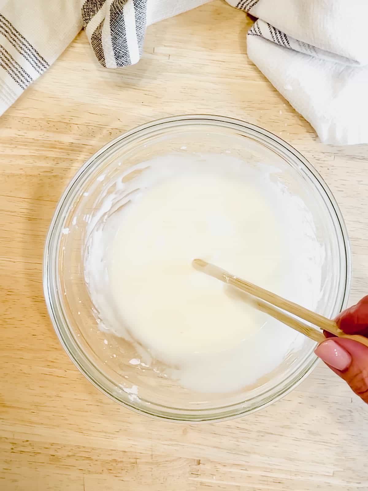 Making lemon glaze.