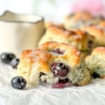 Close-up of a glazed blueberry biscuit.