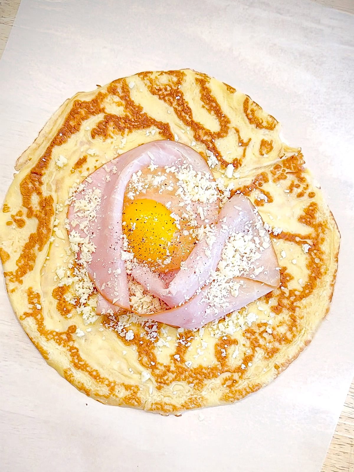 Ham, egg, and cheese on a crepe.