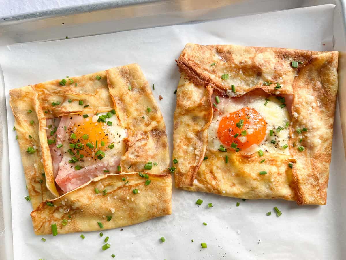 Ham and cheese crepes with a runny yolk egg.