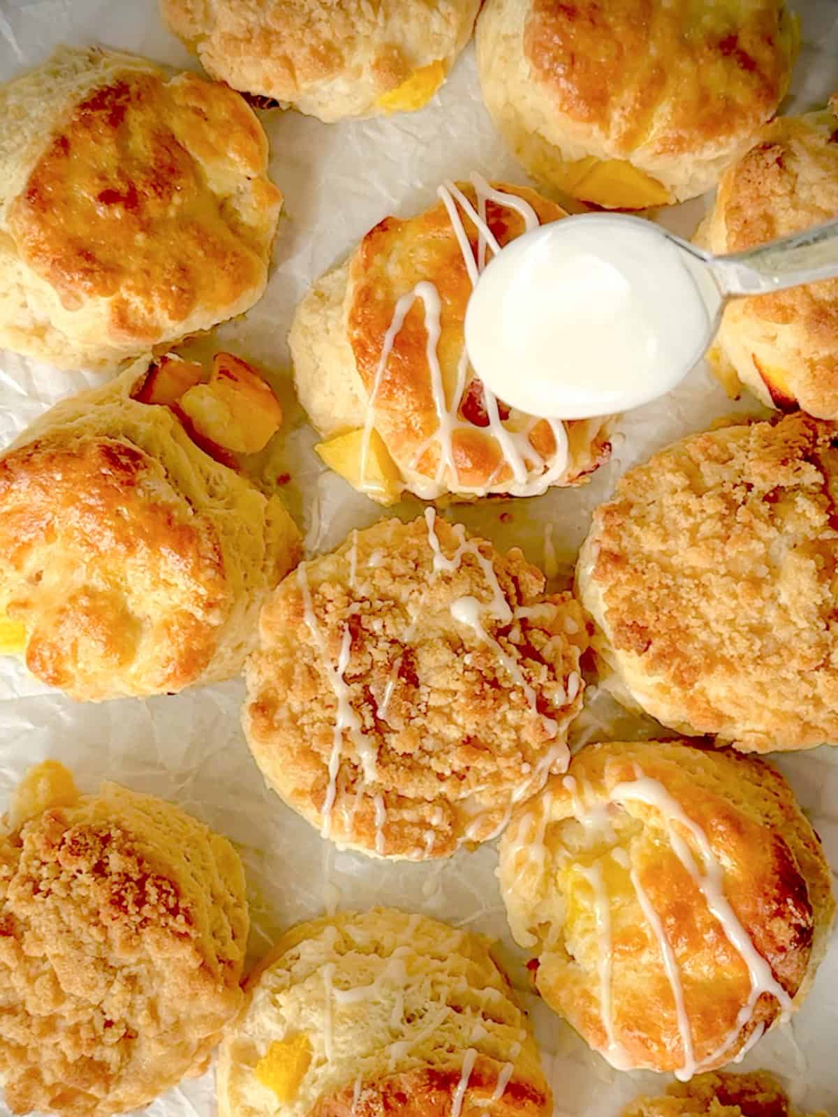 Drizzling vanilla glaze on top of biscuits.