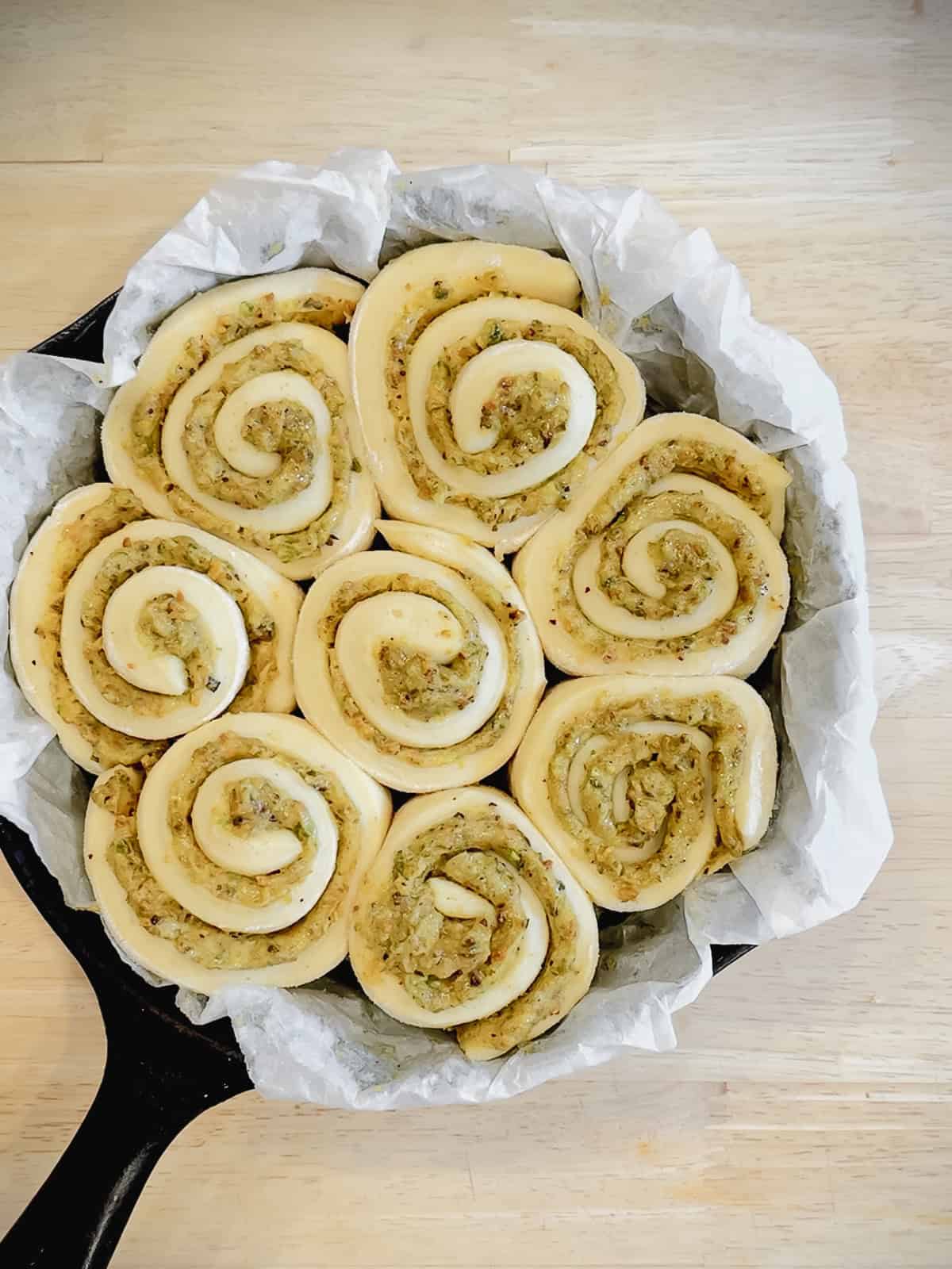 Fully risen pistachio rolls, ready to bake.