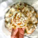 Author's hand holding a pistachio roll.