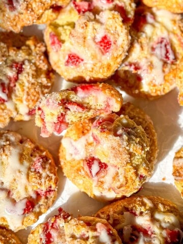 A pile of strawberry muffin tops.