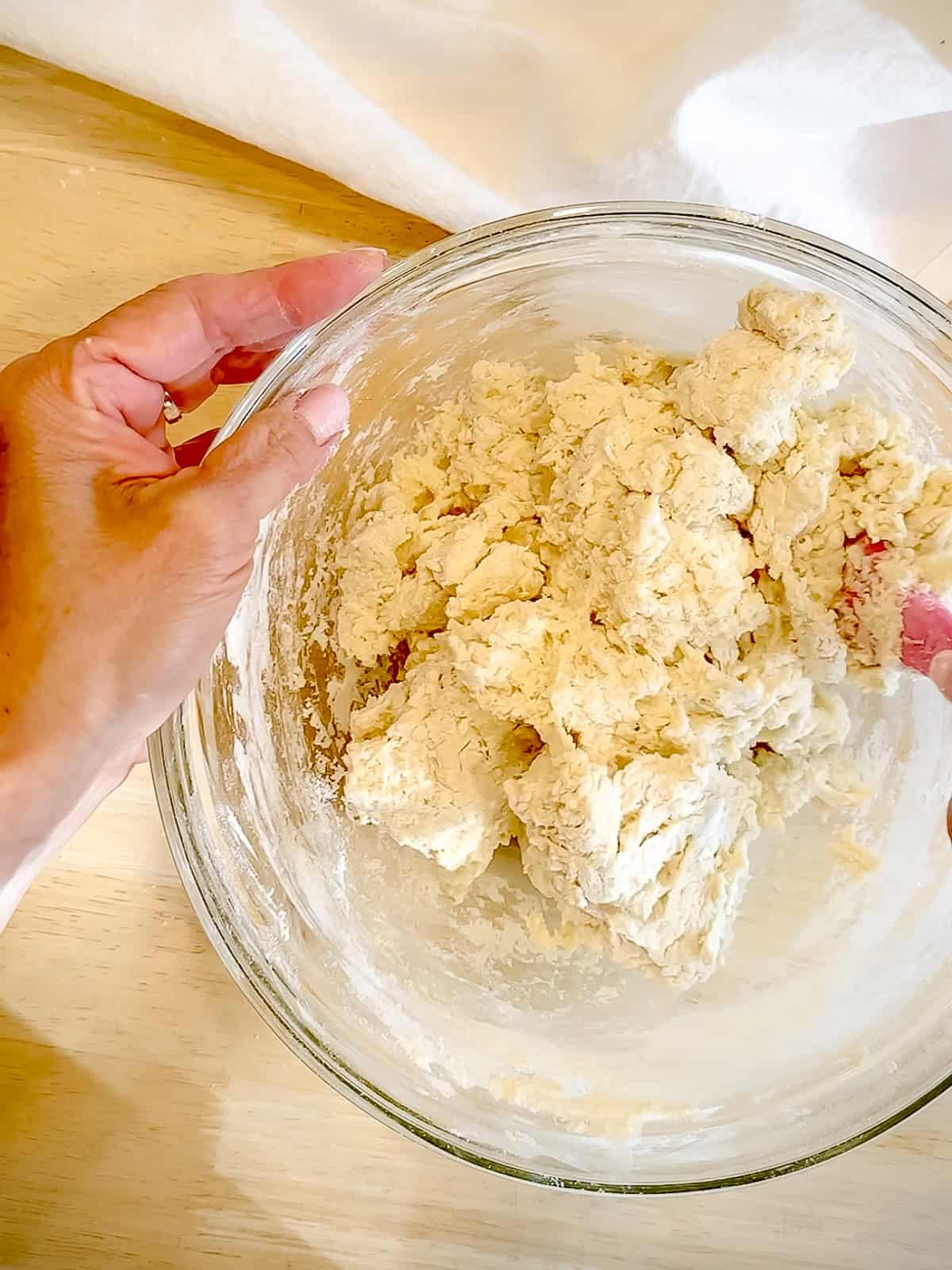 Mixing biscuit dough.