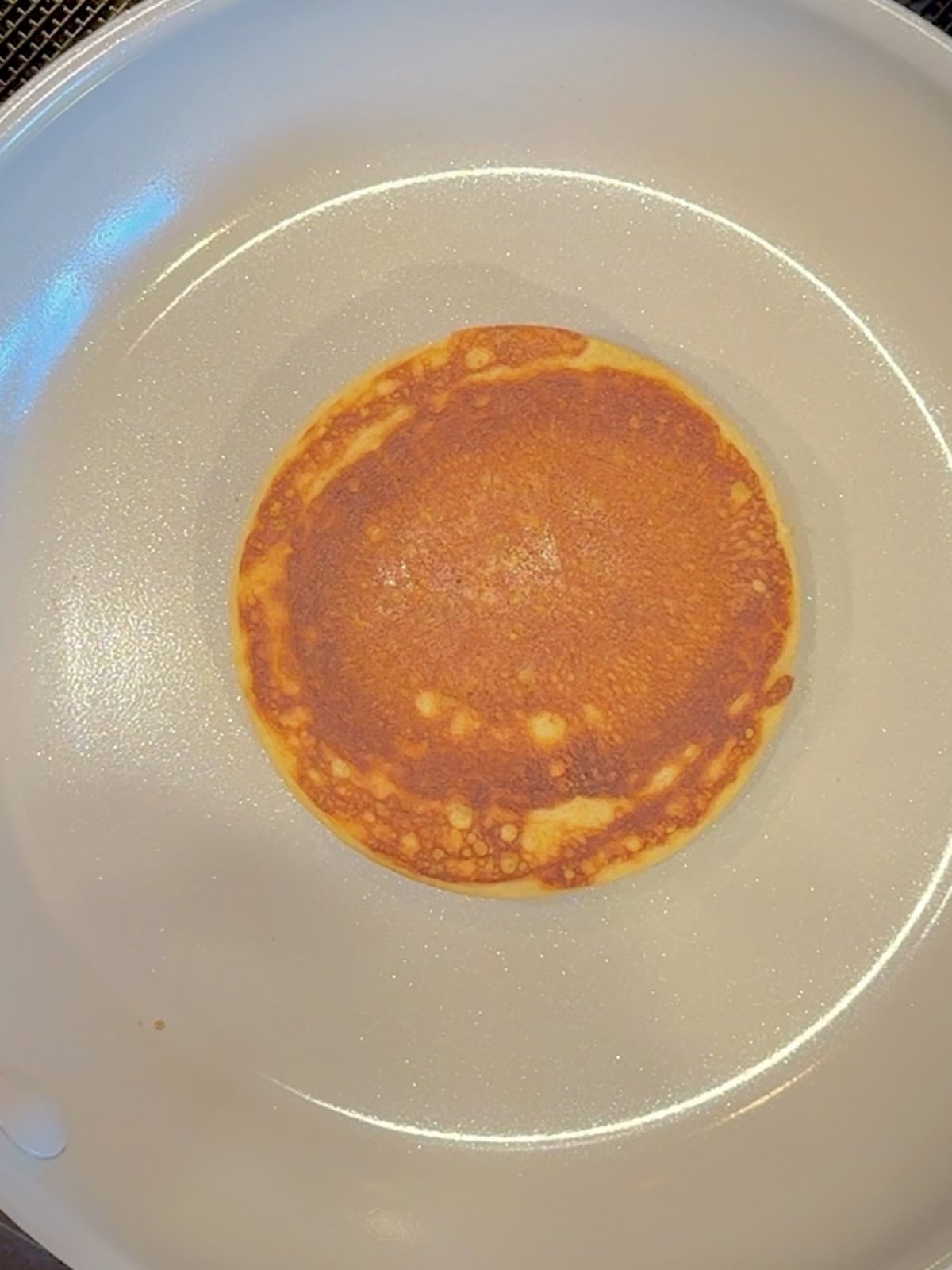 Cooking pancakes for homemade Mcgriddles.