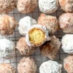 Donut holes on a wire rack.