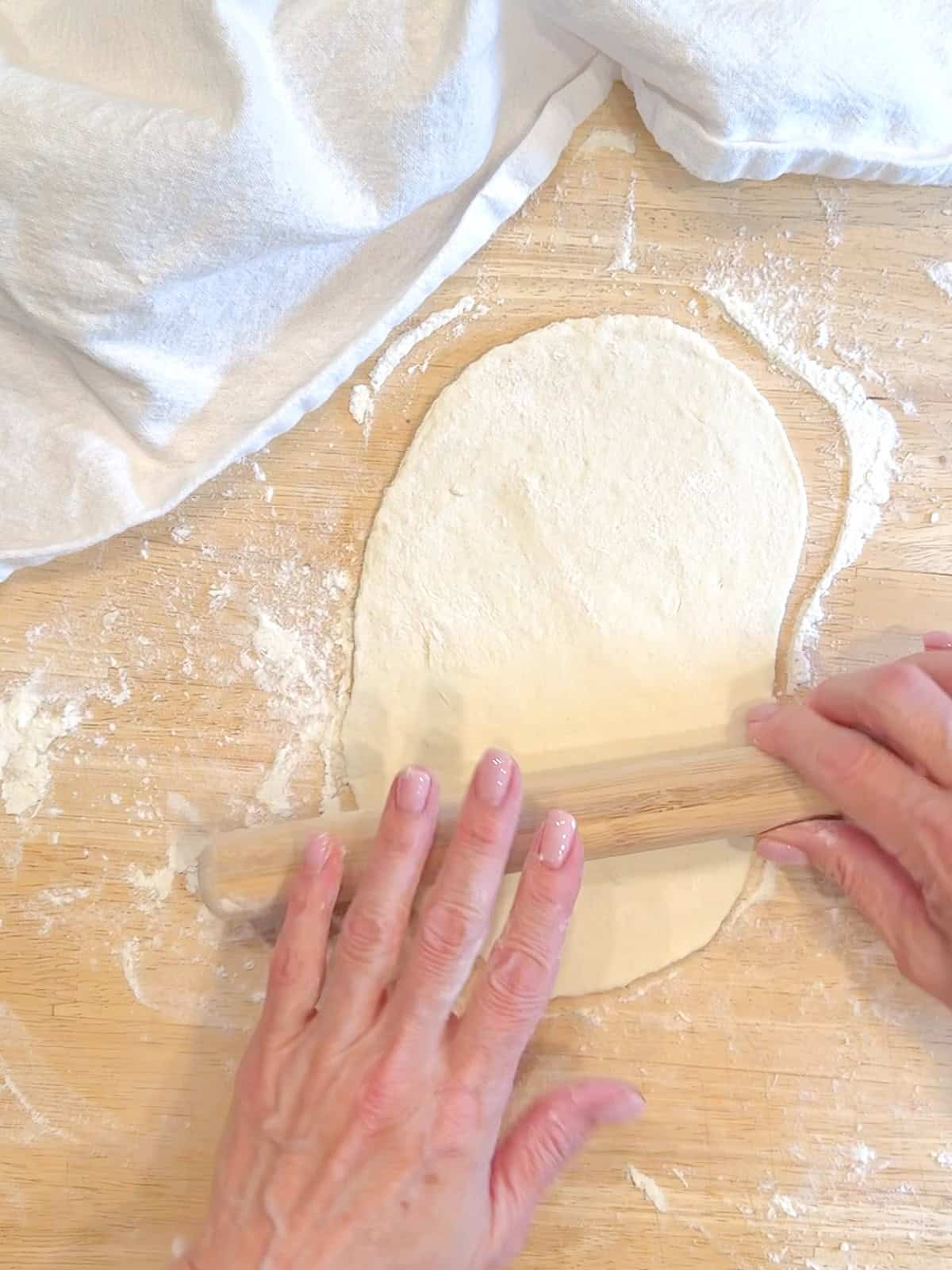 Rolling out flatbread.