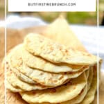 Pinterest image of two ingredient flatbreads stacked on parchment paper.