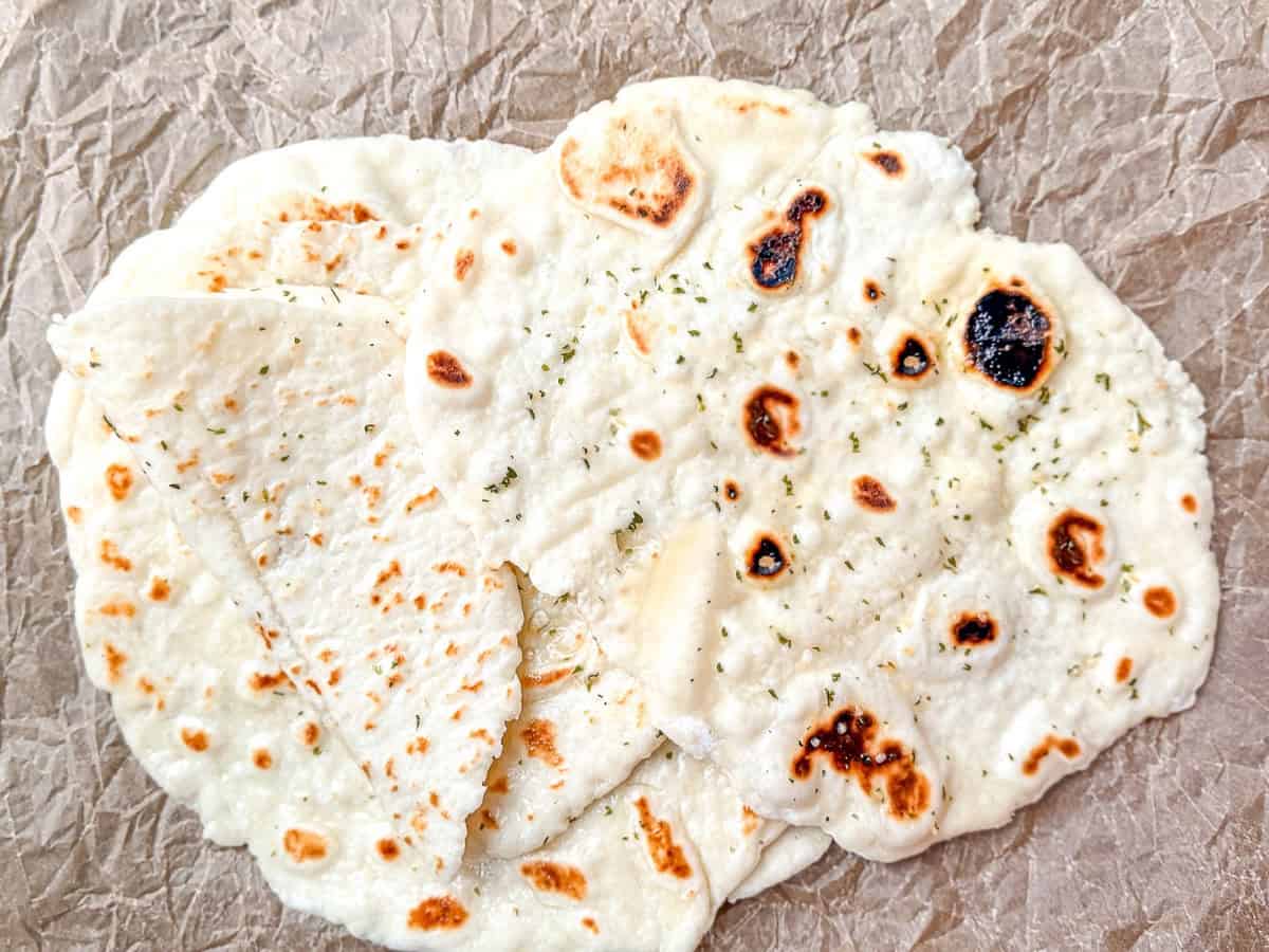 2 ingredient flatbread on parchment paper.