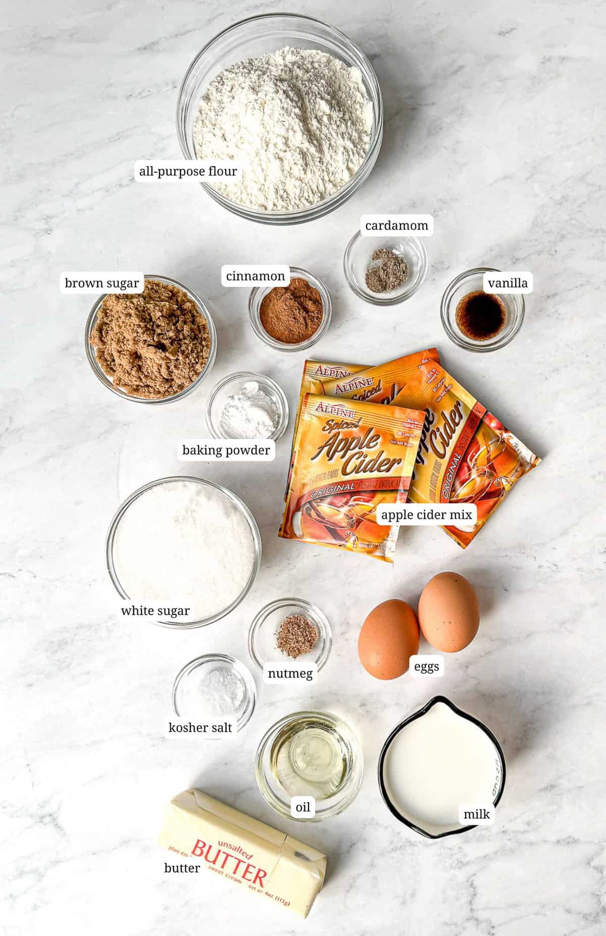 Ingredients needed to make baked apple cider donuts.