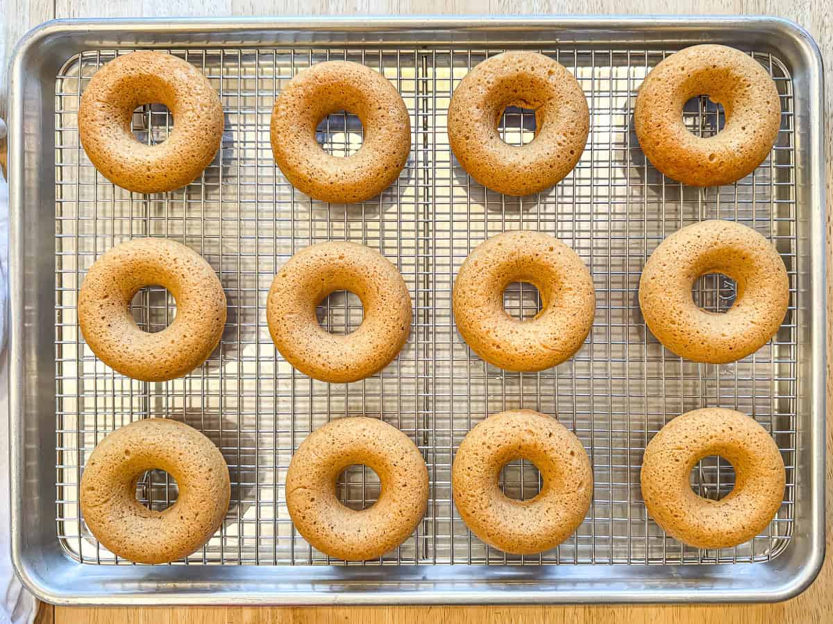 Baked apple cider donuts before rolling in cinnamon sugar.