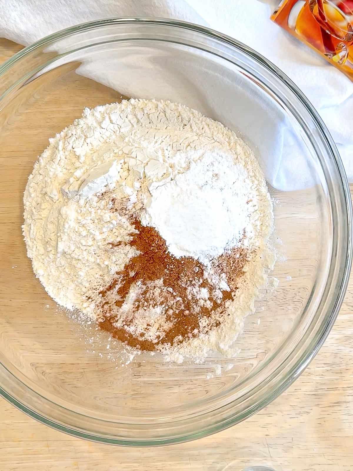 Mixing dry ingredients to make donuts.