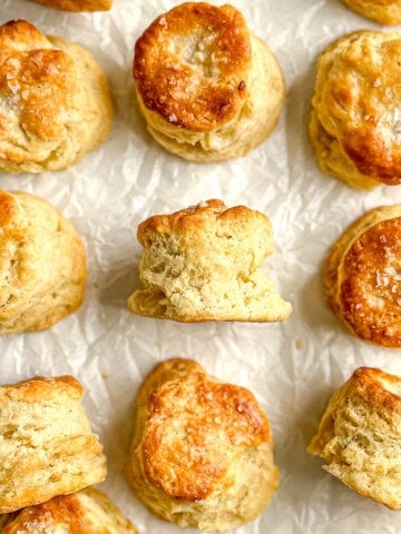 Sour cream biscuits on parchment paper.