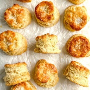 Sour cream biscuits on parchment paper.