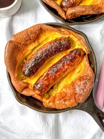 Breakfast toad in a hole with maple syrup.