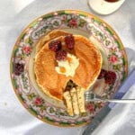 Pancakes with fruit and syrup.