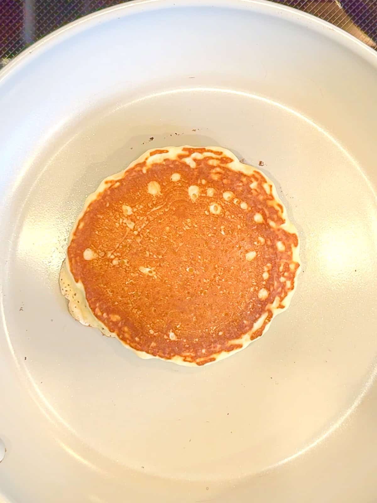 Pancake in a nonstick pan.