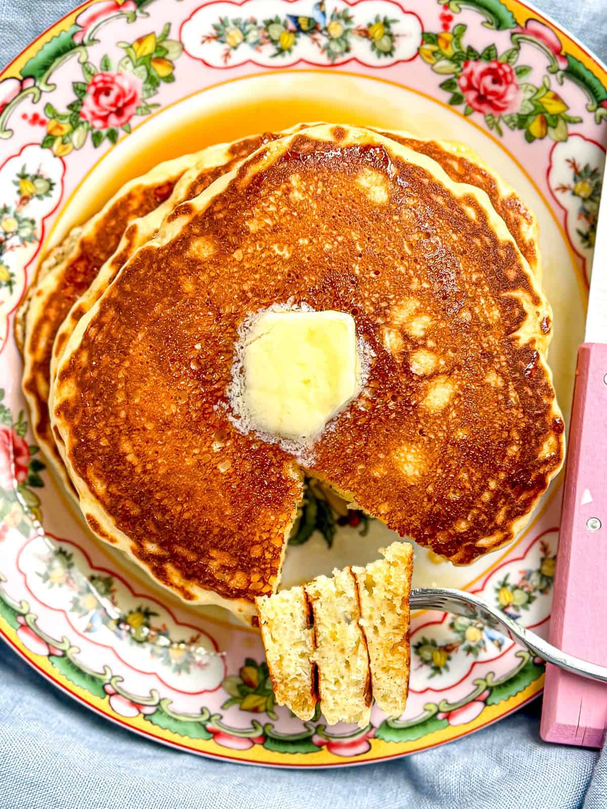 Easy homemade pancakes on a flowered plate.