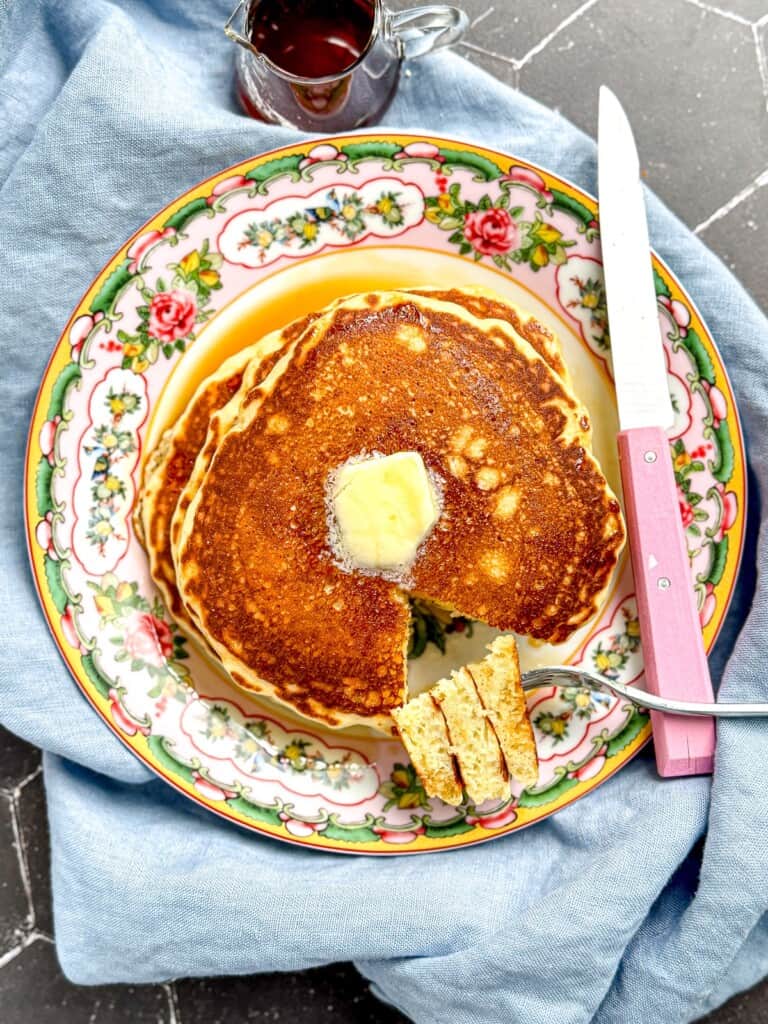Easy homemade pancakes on a flowered plate.