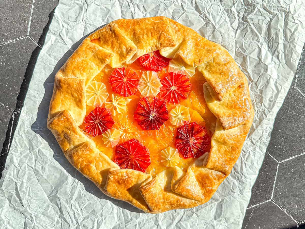 Citrus galette on parchment paper.