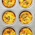 Mini quiche Lorraine in a muffin pan.