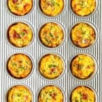 Mini quiche Lorraine in a muffin pan.