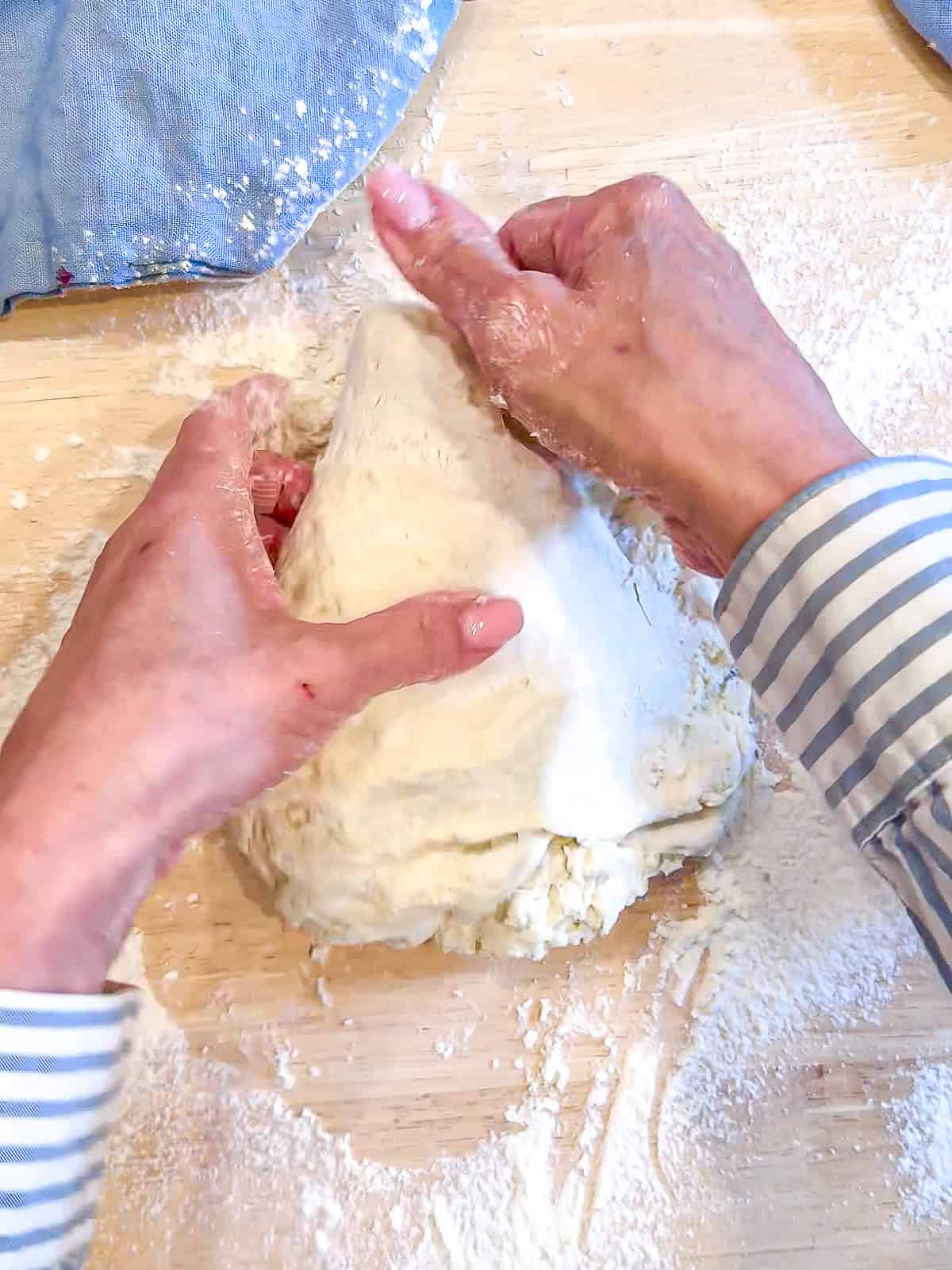 Kneading cottage cheese bagel dough.