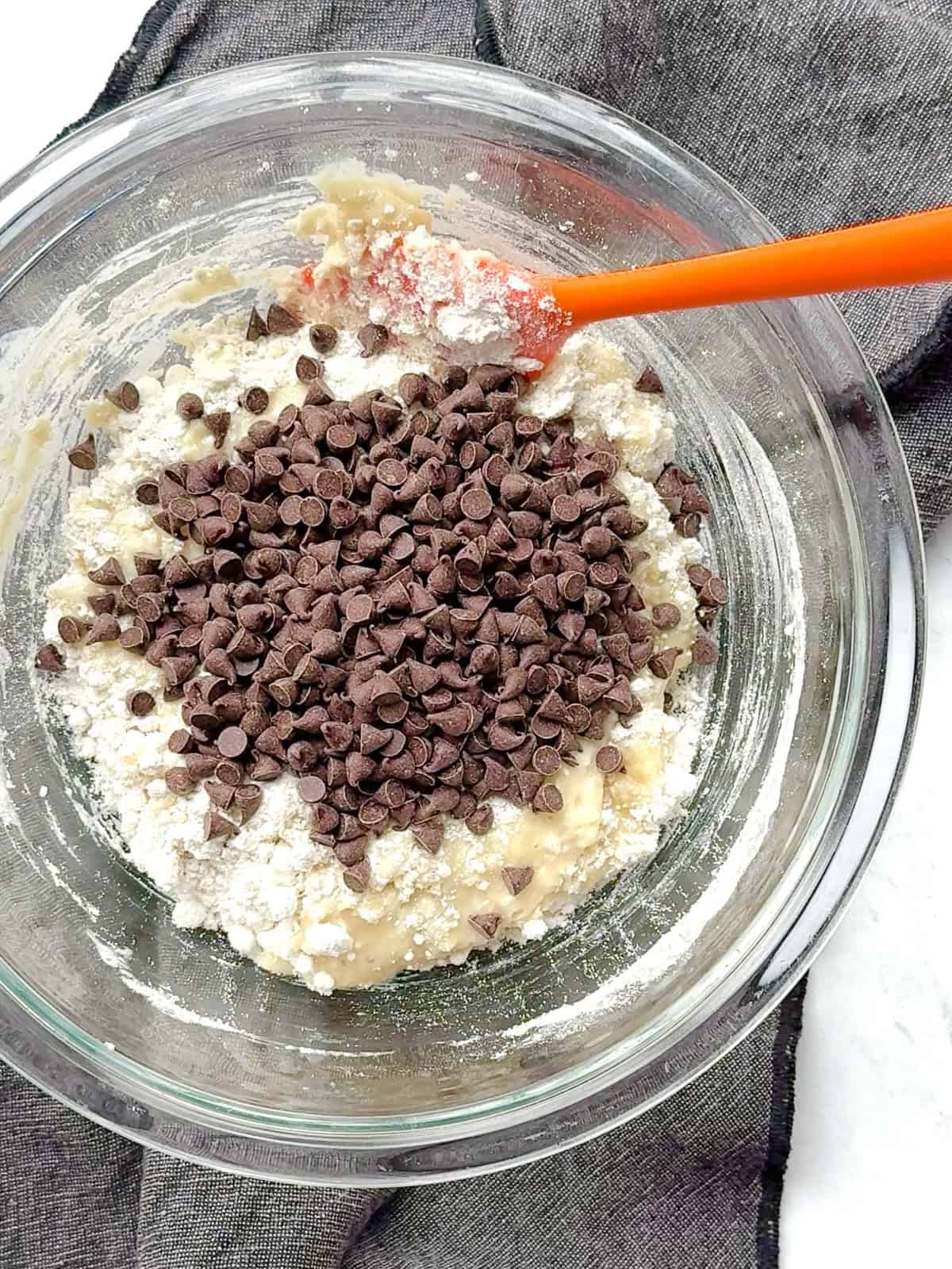 Chocolate chips on top of muffin batter, before stirring.