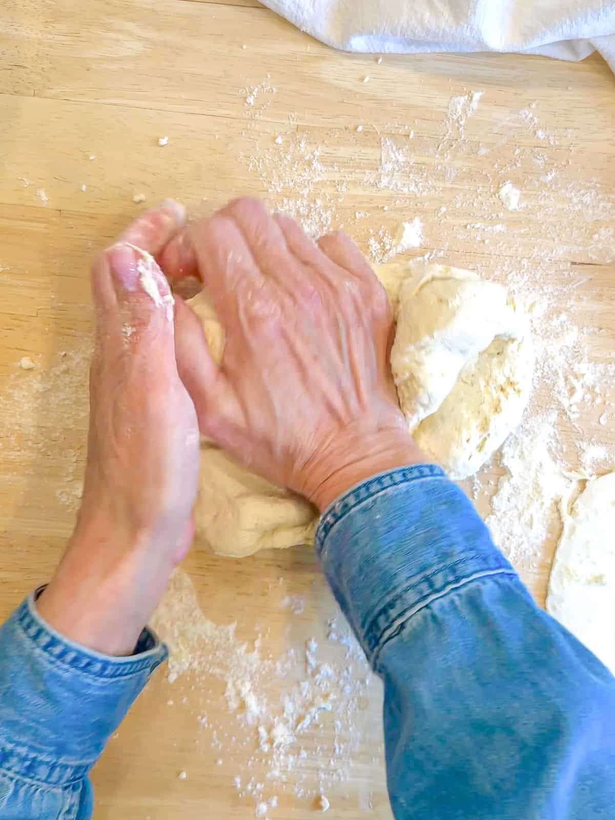 Author's hand kneading two ingredient dough.