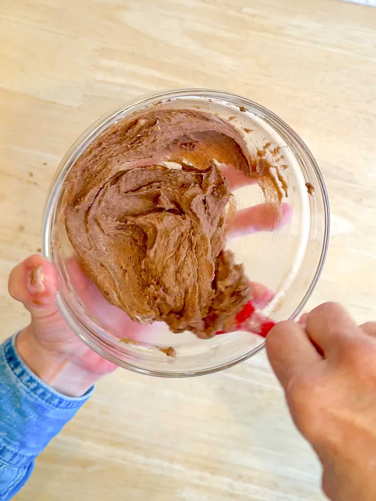 Using a spatula to mix up the cinnamon sugar butter.