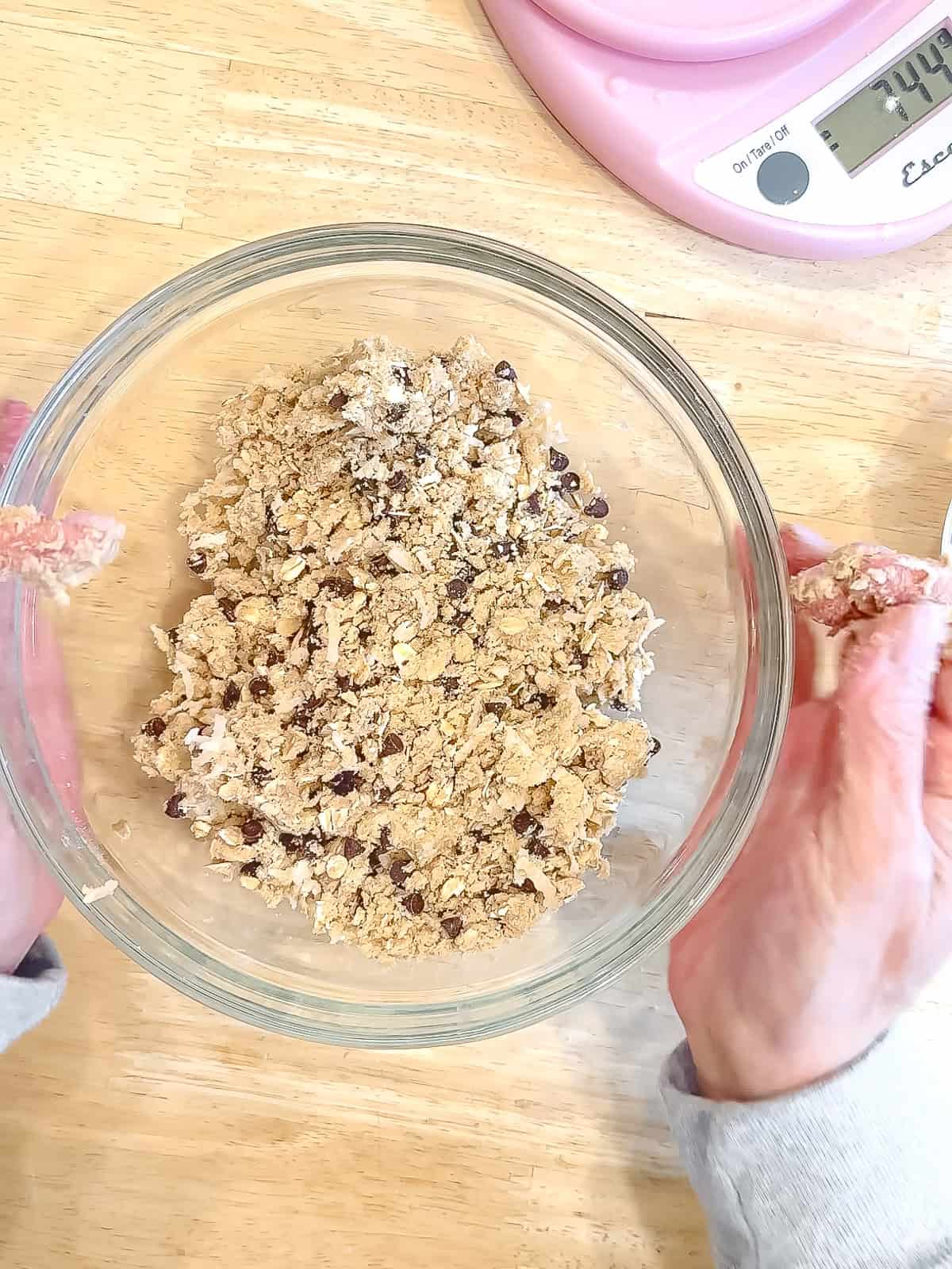 Mixing banana breakfast cake streusel and a glass bowl.