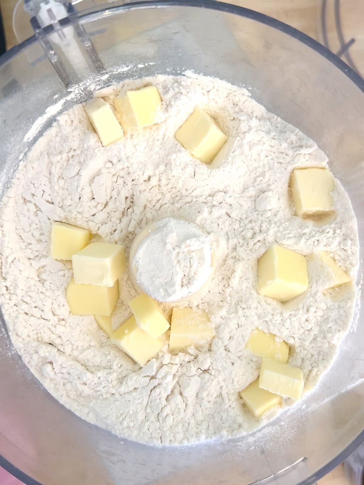 Bread flour, salt, and cold cubed butter in a food processor to incorporate the butter into the flower mix.